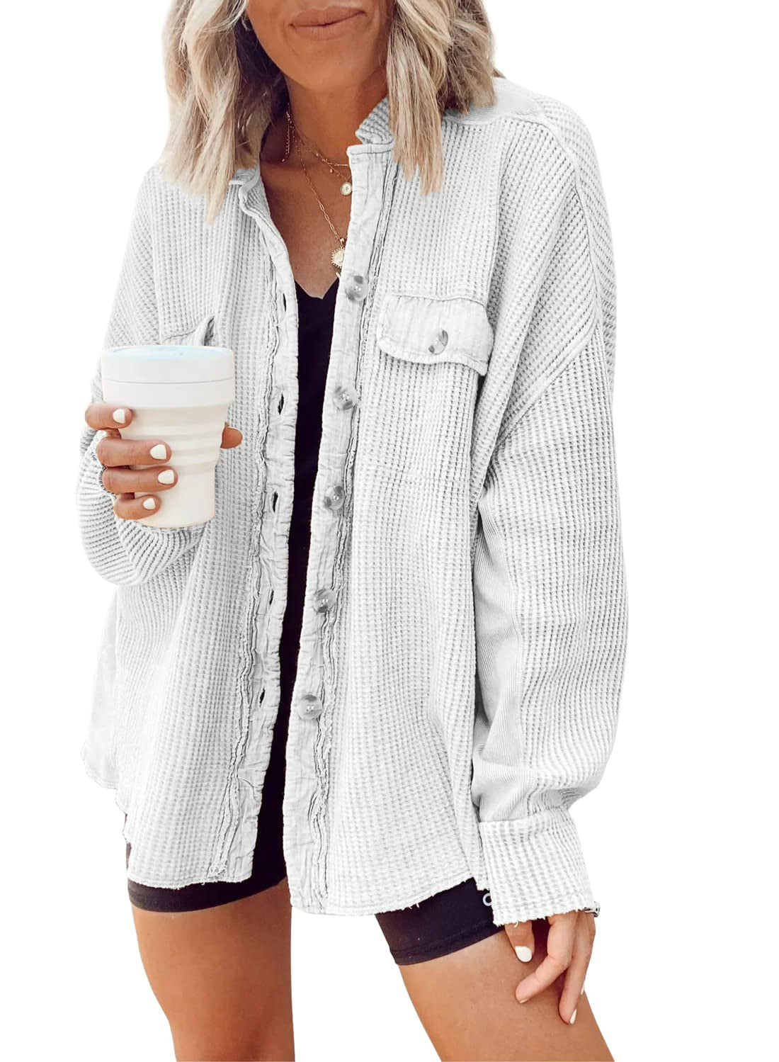 Woman wearing Snuvelle button-up lapel shirt jacket in a solid color