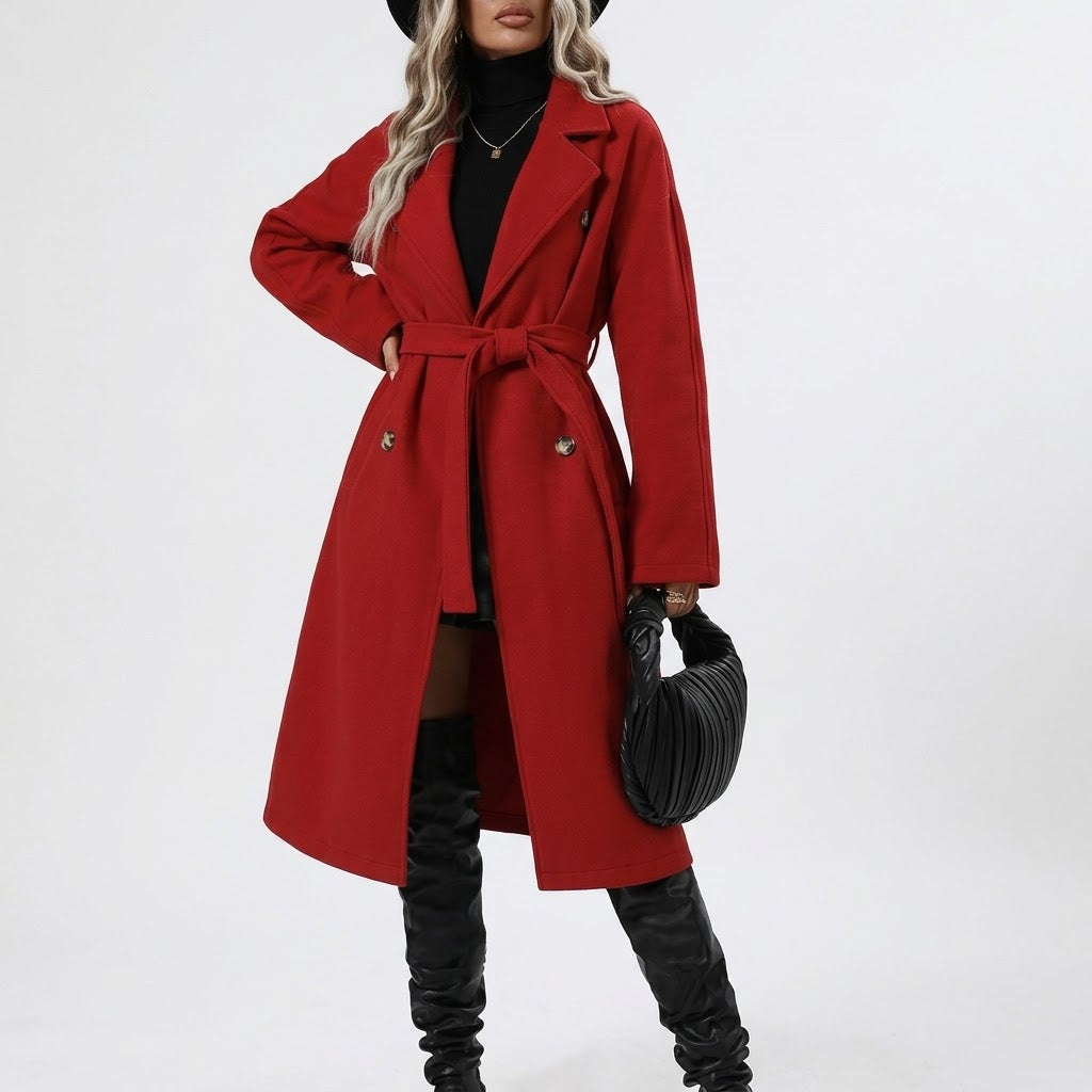 Woman wearing Snuvelle double-breasted belted trench coat with lapel collar