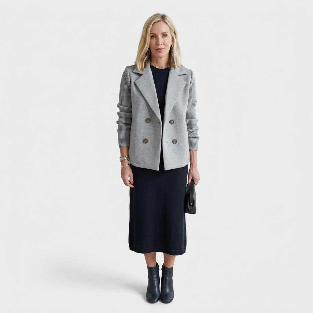 Woman wearing Snuvelle double-breasted lapel coat with knit sleeves