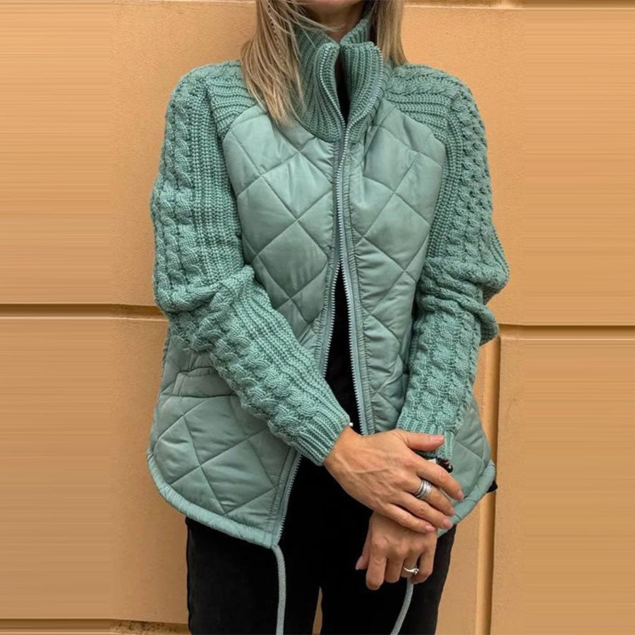 Woman wearing Snuvelle stand collar zip-up winter jacket with pockets
