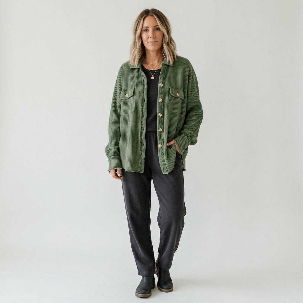 Woman wearing Snuvelle button-up lapel shirt jacket in a solid color