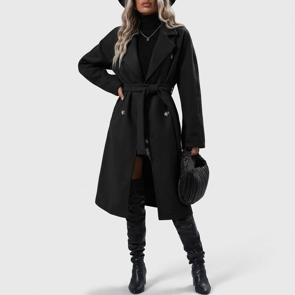 Woman wearing Snuvelle double-breasted belted trench coat with lapel collar