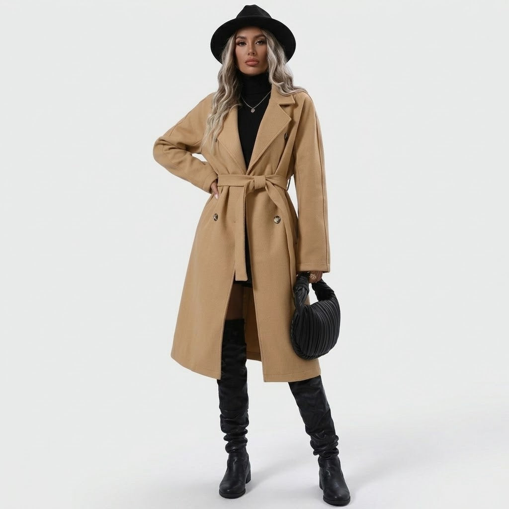 Woman wearing Snuvelle double-breasted belted trench coat with lapel collar