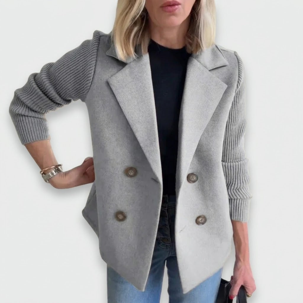 Woman wearing Snuvelle double-breasted lapel coat with knit sleeves