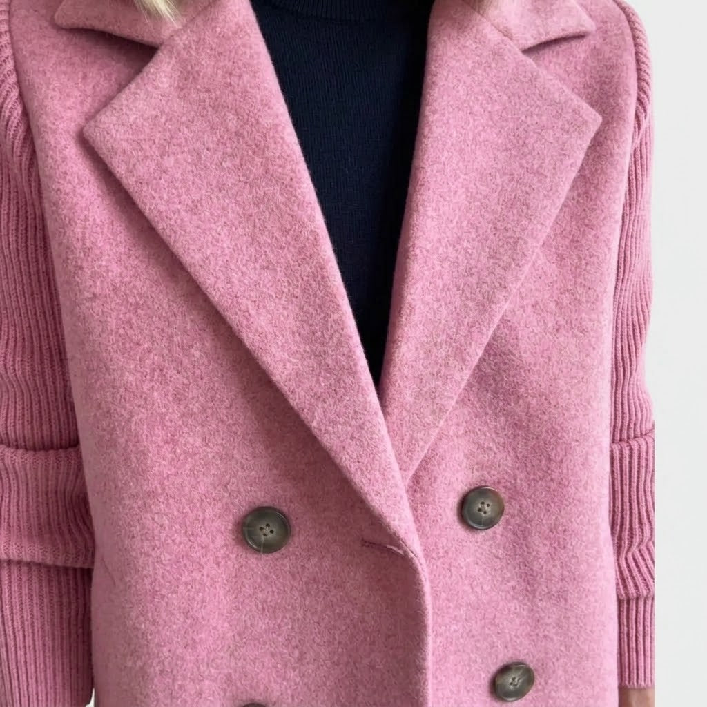 Woman wearing Snuvelle double-breasted lapel coat with knit sleeves