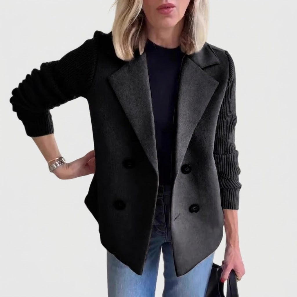Woman wearing Snuvelle double-breasted lapel coat with knit sleeves