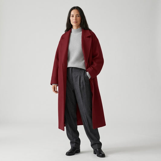 Woman wearing Snuvelle long single-breasted lapel coat with pockets