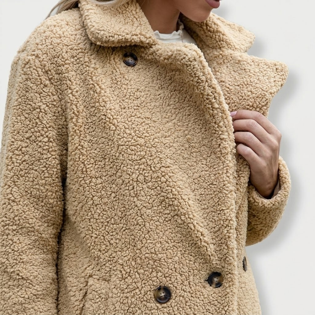 Woman wearing Snuvelle loose fluffy lapel button coat in a soft textured fabric