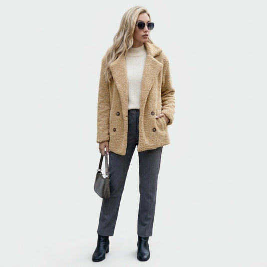 Woman wearing Snuvelle loose fluffy lapel button coat in a soft textured fabric