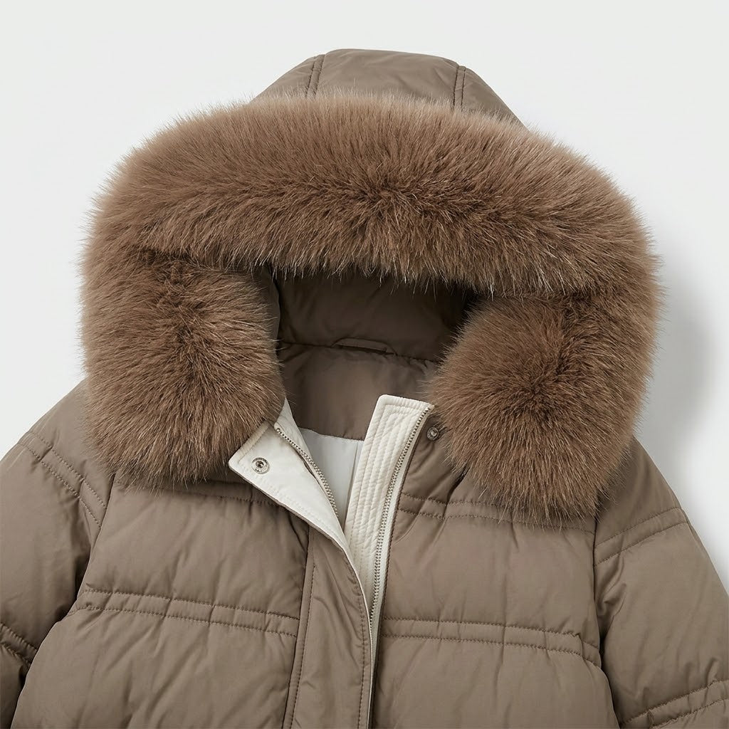 Woman wearing Snuvelle slim belted hooded winter coat with fur-trimmed hood