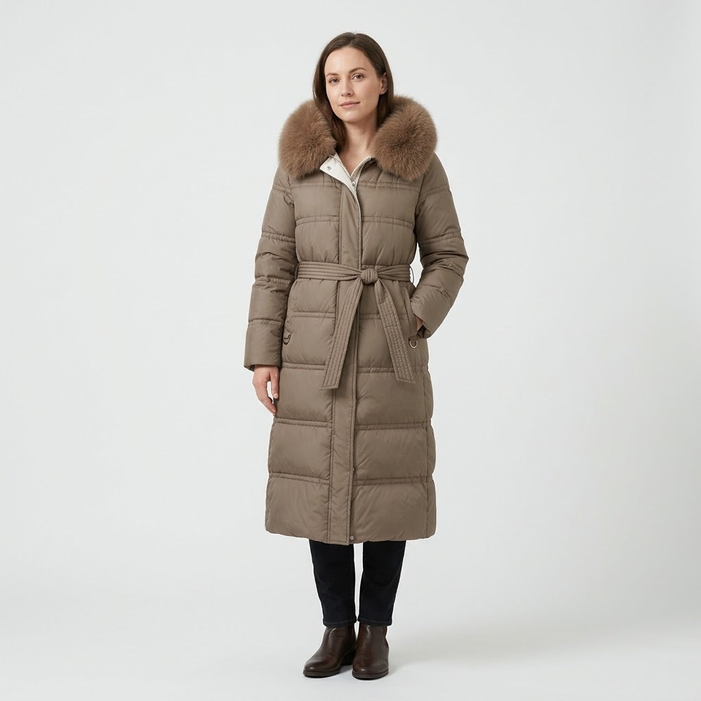 Woman wearing Snuvelle slim belted hooded winter coat with fur-trimmed hood