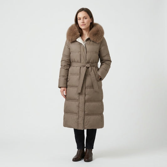 Woman wearing Snuvelle slim belted hooded winter coat with fur-trimmed hood
