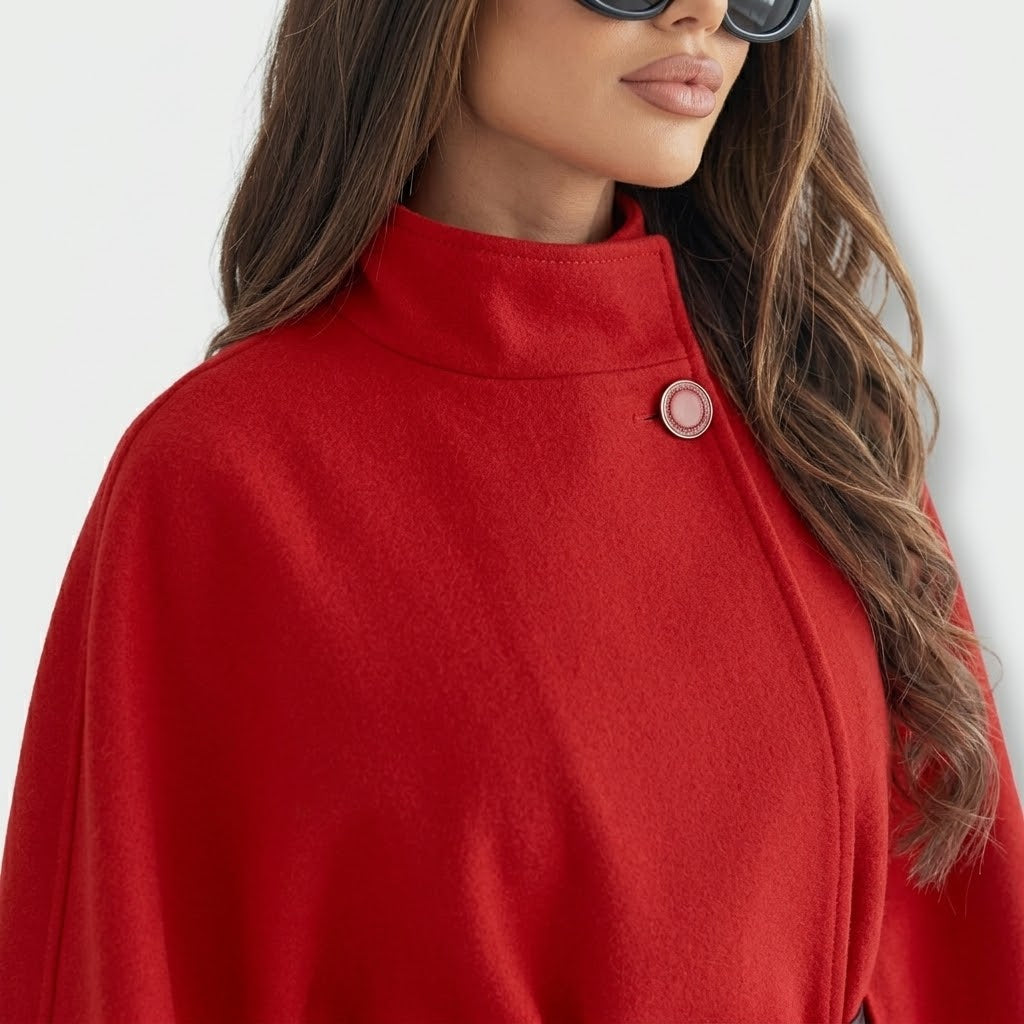 Woman wearing Snuvelle stand collar batwing belted jacket in a solid color