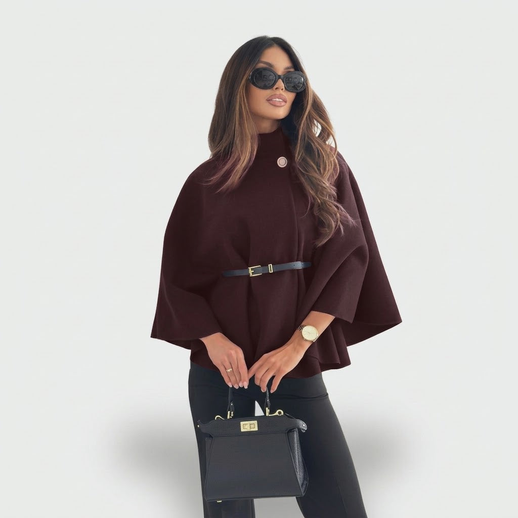 Woman wearing Snuvelle stand collar batwing belted jacket in a solid color