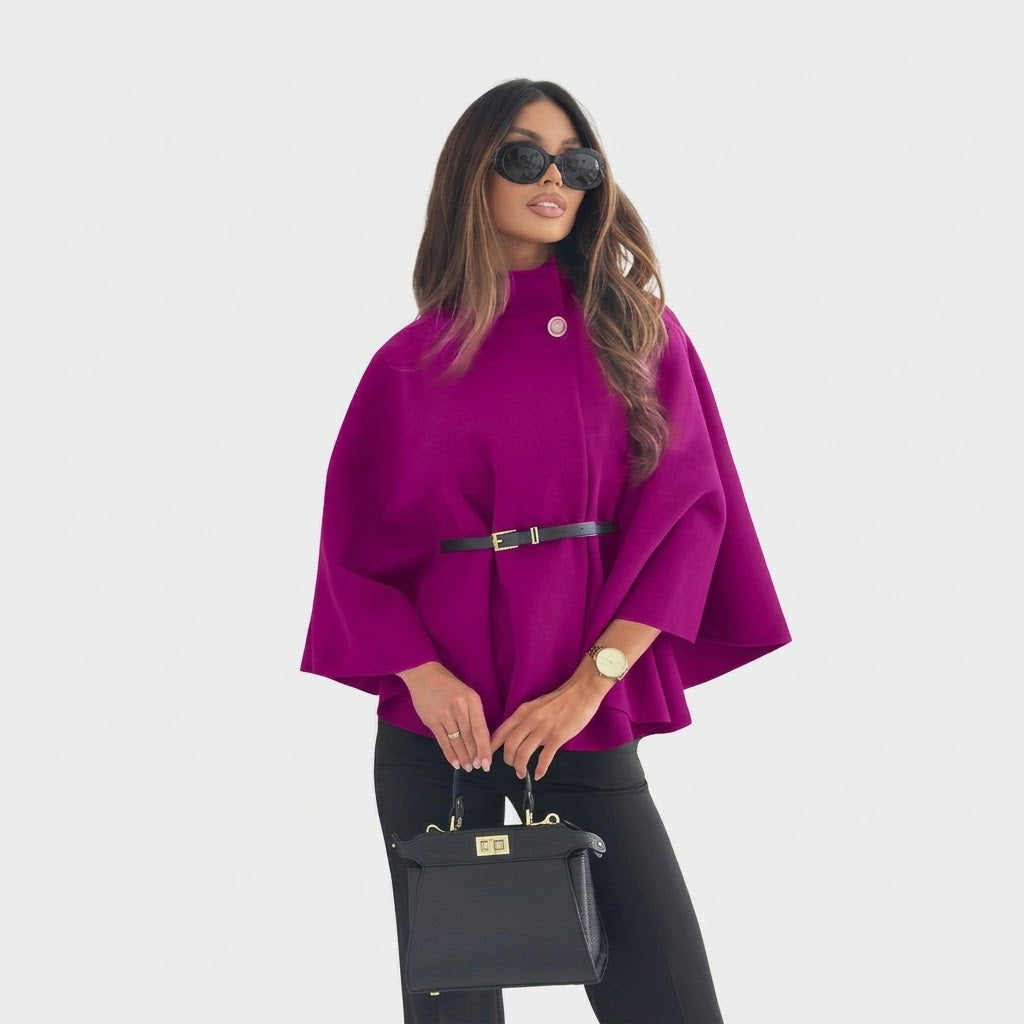 Woman wearing Snuvelle stand collar batwing belted jacket in a solid color