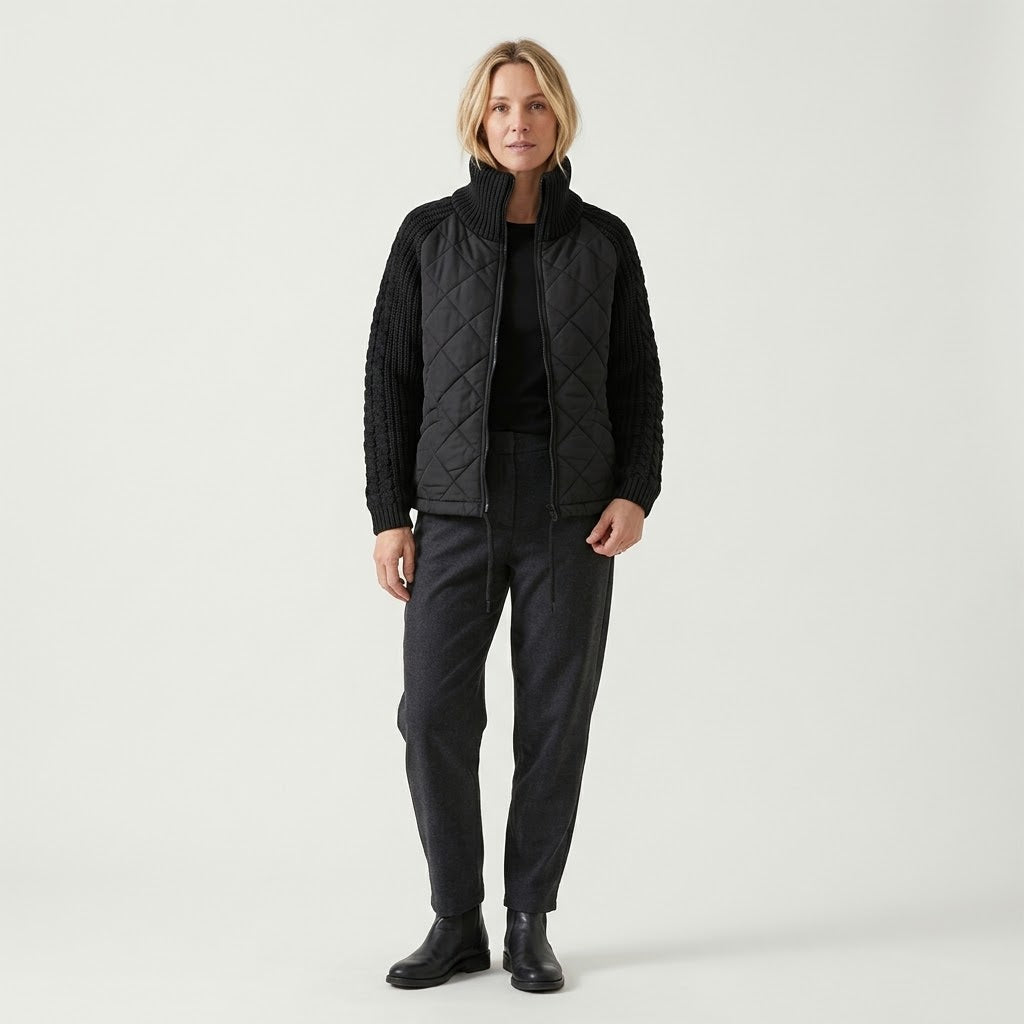 Woman wearing Snuvelle stand collar zip-up winter jacket with pockets