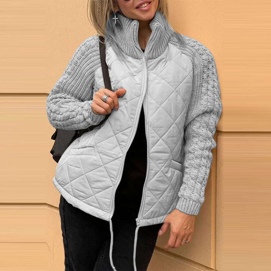 Woman wearing Snuvelle stand collar zip-up winter jacket with pockets